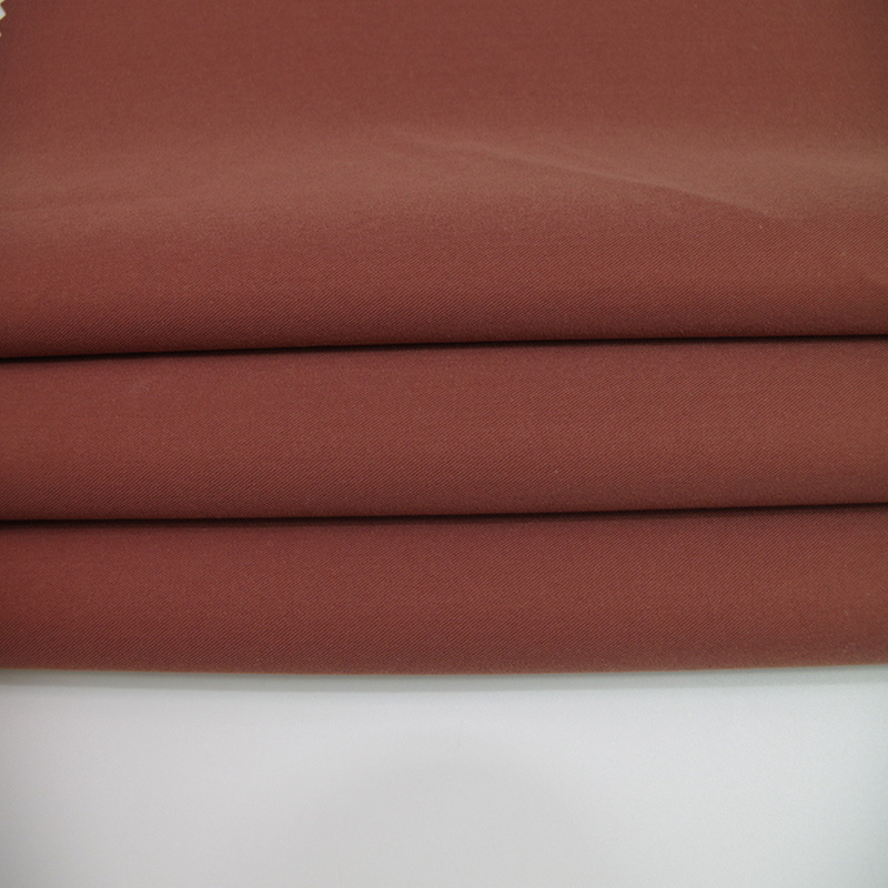 现货供应 全涤高品质面料 秋冬时装棉服羽绒服潮流布料防风