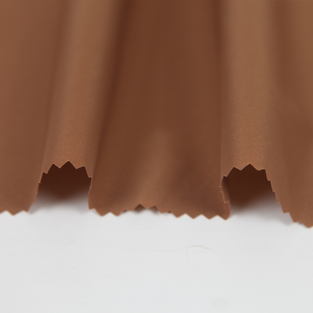 厂家直供全涤面料秋冬季上衣冲锋衣面料休闲服棉服羽绒服面料批发