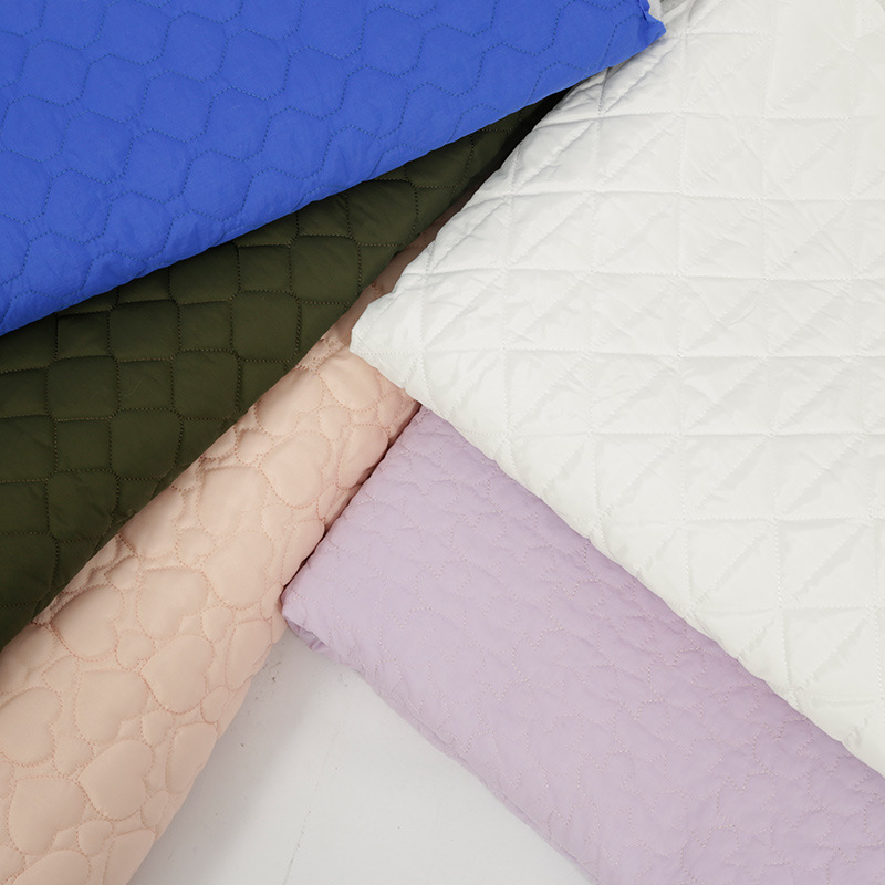 潮流绗绣绗棉面料 厂家批发 品质加棉菱形棉服服装面料 现货直供