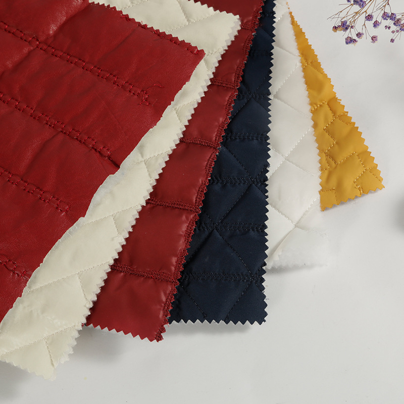 厂家直供菱形格绗绣绗缝面料批发 防水双层棉袄时装刺绣布料