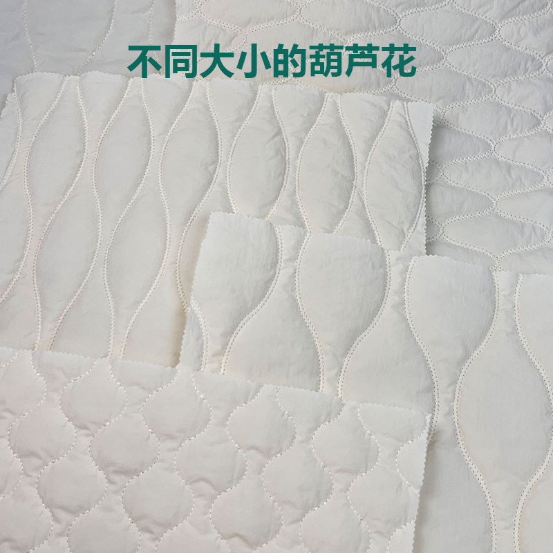 定制特种绗绣绗缝棉布料夹棉包面料绣花布云朵包服装面料童装宠物