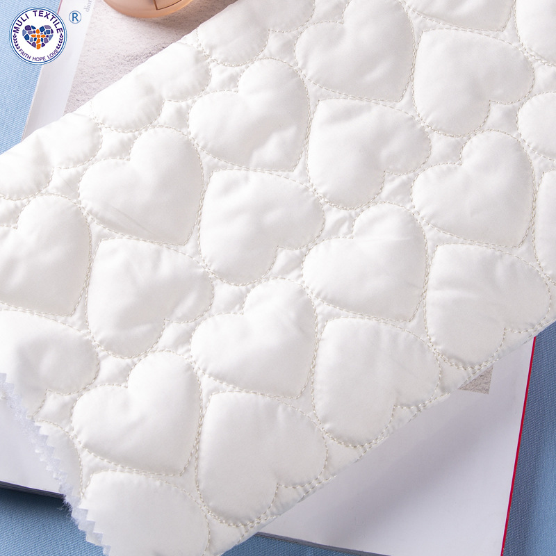 厂家直供尼丝纺爱心绗棉夹棉面料秋冬绗缝羽绒外套云朵包面料批发