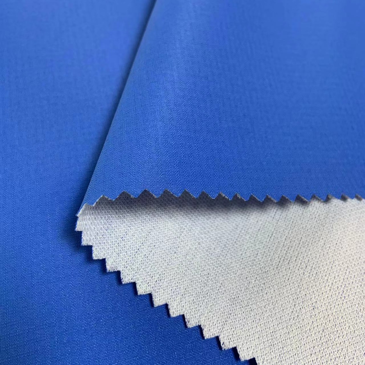 可定制150G全涤双线格PU涂层复合针织布志愿者服装校服面